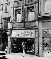 Old black and white photo of the 60 Stanley Street exterior of Hessy’s Music Centre