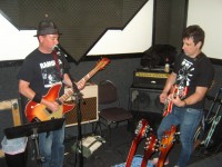 Dan-o on vocals with Paulie --- that's the headstock of Gary's 4002 Bass in the foreground