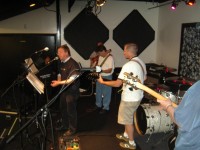 Tom O on vocals, Syeve in far background, Gary, Brian and Pat's 4001 C64 headstock and neck