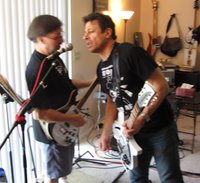 Gary and Paulie handling some back up vocals on the mic.  Paulie has the BlueBoy WB (with Silver Guards and Oven Knobs) which was a Fortune Guitars refinish job