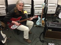 Kira playing the  Checquered Bound Ruby and the Lennon '58 model on the guitar stand.  Southern Calif residents might recognize the Vox AC-30 which was hot-rodded by the Snowman and now is proudly in Kira's arsenal !