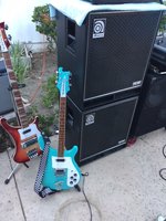 FireGlo 4003 Bass and the Refinished Daphne Blue 480 next to Mark Fleming's Ampeg Speaker cabs