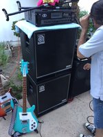 Closer look of the Bass Amp head on top of the Ampeg cabs, with the Daphne Blue 480 hanging out