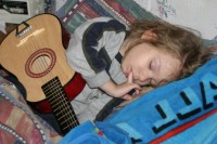 Christian sleeping with guitar.jpg