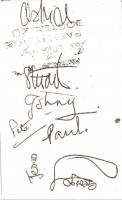 The Beatles first autographs appeared in late 1960 and included the original five members: John Lennon Paul McCartney, George Harrison, Pete Best and Stuart Sutcliffe.  With the exception of contracts, only three sets of autographs have surfaced from this period.  They were on album pages and the back of an unpublished photograph.  Signatures on back of photograph featuring the original five including Stuart Sutcliffe.  It is also signed by Astrid Kirchherr, his girlfriend and famed photographer.