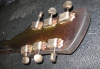 The headstock took the burnt of the heat...  But the tuners work fine!