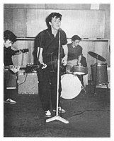 Tommy Moore arrived after a couple of numbers.  At 36, Tommy didn't fit in with the other Beatles.  Lennon (19 at the time) especially kept up a constant stream of caustic remarks aimed at the drummer.