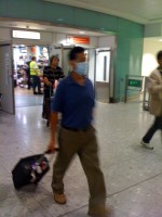 I knew he couldn't be far away.......as people started coming through customs wearing their "Bishop Fart Protector" face masks...........