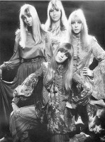 Apple Boutique designs. From left: Pattie (Boyd) Harrison, Cynthia Lennon (John's wife), and Maureen Starr (Ringo's wife); kneeling in front: Jennie Boyd (George's sister-in-law).