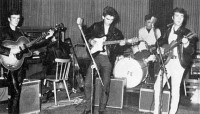 It's unlikely that they ever had two basses going at the same time.... as these photos show, Paul would be on piano or simply sing when Stu sat in on bass.
