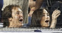 Singer Paul McCartney and Nancy Shevell sing during the seventh-inning stretch at the New York Yankees'<br />       baseball game against the Texas Rangers at Yankee Stadium on Wednesday in New York.<br />(AP Photo/Kathy Willens)