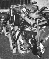 There's a pic on the web, it was taken in Sheffield (December 8, 1965) and it shows all the Beatles guitars before that show. It's easy to recognize the Rickenbacker 325, Paul's '63 and the '61 Hofner (used as spare) basses, the acoustic Gibson J160E, the Gibson ES-345TD, the '65 Rickenbacker 360/12.  A custom color (Candy Apple Red?) Stratocaster with a matching coloured peghead stands in the center of the pic. What about this guitar? Does anyone know anything about this guitar? No one never wrote a line about it. And, of course, this is the only one picture ever seen. Did John play this guitar too?