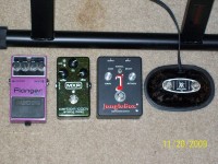 L to R; Boss BF-2 Flanger, MXR Carbon Copy analog delay, Jangle Box JB-1 compressor/sustain, Music Man Reverb/Distortion foot switch