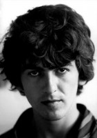 George's hair was much wavier than many people realize and they used to work on straightening it.
