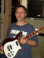 Gary's favorite six string, the Burgundy 600 series with Binding, Toasters and full width Inlays