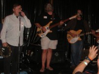 Tom, Pat and Mark performing during the Byrds set