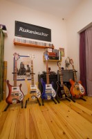 My Rickenbacker wall, on the background a RockFour poster to which the posed with their 360/12V64.