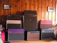 The tan, red, and purple amps are British '90s Korg amps, the trapezoid head on the left is a '64 JMI Vox AC30 Super Twin, the AC15TBX is actually sold now, the black 2x12" cab on the right is a NCM cab that I currently have on eBay, the Super Beatle contains a 15w Vox Night Train head, and the SB's cab only has one 12".  In case anyone cares.