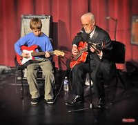 A guitar student of mine and me playing at the recent Americana Music Academy holiday concert.