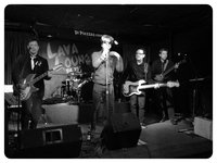 This is why one should always wear shades when one is the object of candid, live gig photography; everyone else looks great, and even after a red-eye fix, it looks like I'm possessed. . .  or, an extra from the upcoming movie "Host."  . . . Just look at the Rick, just look at the Rick.... :)  .