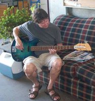Woody test-driving Kira's superb AquamarineGlo (?) bass which was refinished by Paul W