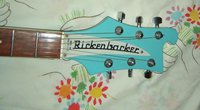 Schaller tuners replaced the originals when it was refinished. Note the Model Number 480 wording on the Truss Rod Cover.