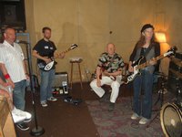 Dan-o at the mic, Doug, Paul W and Kira jamming