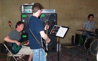 Woody with the Paul W refinished Aquamarine Glo bass, Doug on the JetGlo and Harry sitting in on drums