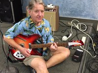 Gary testing a 12-string pedal courtesy of Guitar Showcase