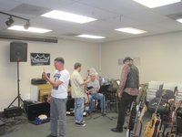Richard Longacre of Guitar Showcase on the right, checking out the gear as we set up for BARC,with Woody on the left, Doug and Don   (photo courtesy of Gary modrock)