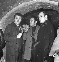 Thats Alun Owen on the left (with Paul peeking through)..... curiously the Beatles last Cavern gig was August 63.  Alun Owen wasn't brought in to write AHDN until early 64.  So either Epstein knew Owen in the summer of 63, or this pix was taken at the Cavern during a non-Beatles concert.