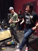 Modified Pedal Board in use at Sunday's Memorial Jam. Board at feet of Spence playing 370WB, Scotty playing the V63 bass and Paulie singing and dancing .... on a Ramones number