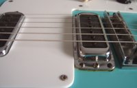 Low action and flat neck radius brings the strings real close to the pole pieces on the Transitional High Gains giving the 480 a real "biting" hot, gainy tone