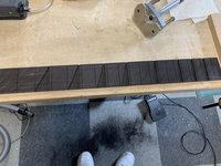 The whole fretboard slotted for inlays
