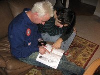 Trottsky and Biscuti peruse the many Rick errors in a popular guitar price guide