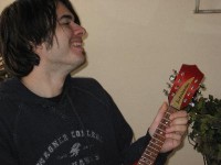 Is that John Biscuti, actually SMILING in a photo??? Alert the press!