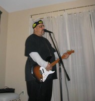 Pat DiNizio performing solo in Dave's house.