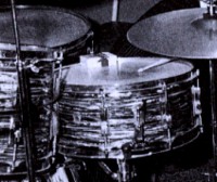 Another early muffling technique was to use a cigarette  pack on his snare.